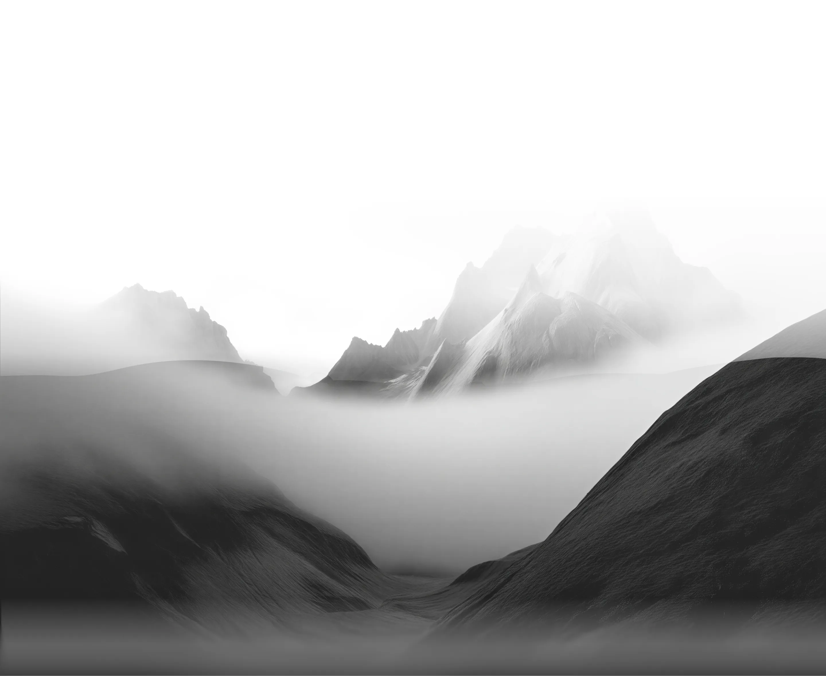 Fog enveloping a mountain range with sharp peaks in a grayscale landscape.